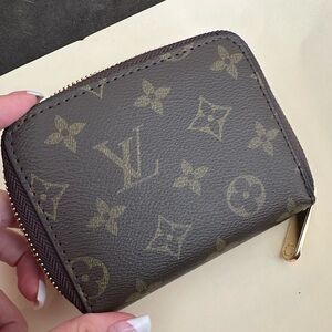 Small L V zippy wallet